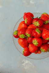 Fresh strawberries on a glas plate, plateau. Isolated.