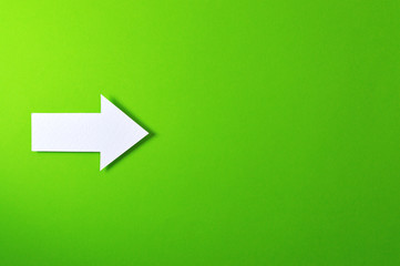 one solid arrow on green background