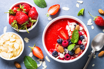 Smoothie bowl with fresh berries and nuts. 