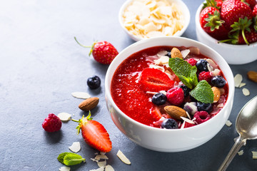 Smoothie bowl with fresh berries and nuts. 