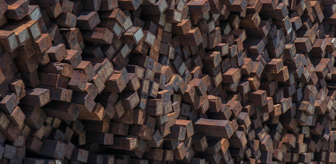 Close up photo of a stack of discarded and unused railroad ties.