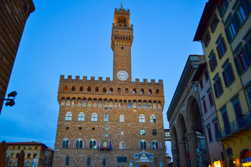 Fototapeta na wymiar Illuminated Palazzo Vecchio (Old Palace) in Piazza della Signoria at evening. Florence, Italy.