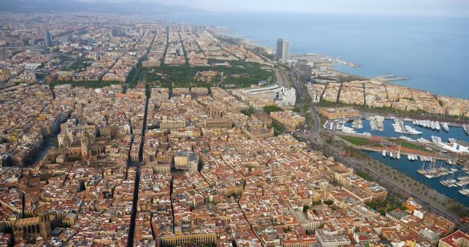 Aerial view of Barcelona Old Town and marina with boats, Spain