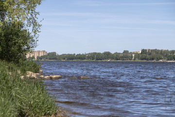 River coast under blue sky. Spring.