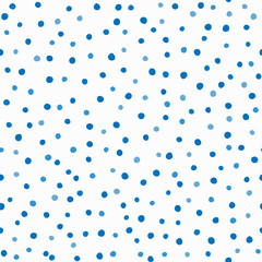 Blue rounded dots randomly scattered on white background. Seamless pattern drawn by hand.