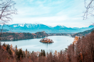View of Bled Lake during Autumn with Bled Castle and snow and mountains in background, Bled Lake, Slovenia