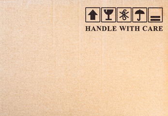 Fragile symbol on cardboard background.