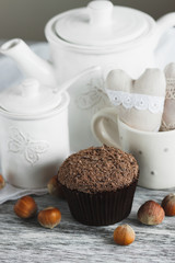 Cups with cacao and marshmallow, cupcakes and different decorations