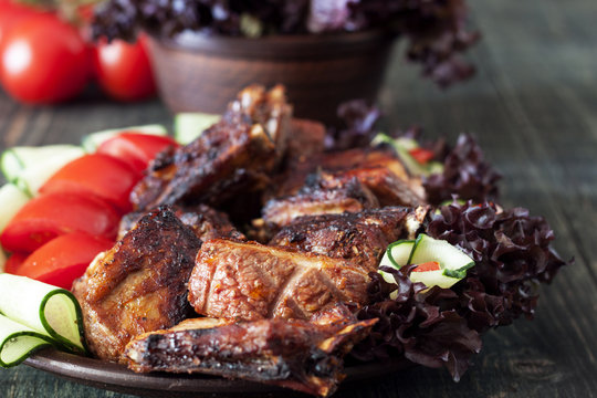 Pork ribs, grilled with fresh vegetables