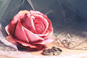 Wedding still life with rings, tiara and veil