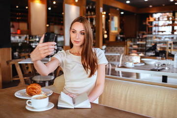 Girl in cafe with capuccino