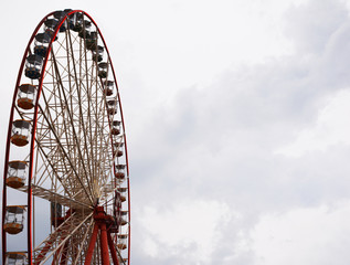 Ferris wheel on sky background