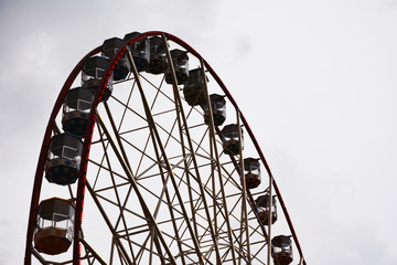 Ferris wheel on sky background