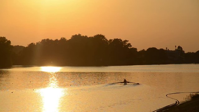 Jarun lake near Zagreb, Croatia. Sport and recreation. Rowing, kayak and canoe. Rowing team training at sunset