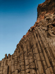 A rock formation at a cliff at Reinsfjara Beach in Iceland