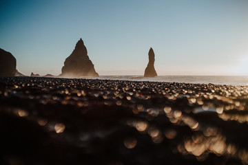 The famous Reinsfjara Beach in Iceland with some rock formations in the water