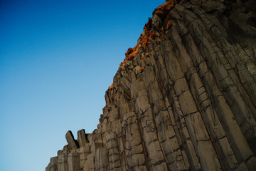 A rock formation at a cliff at Reinsfjara Beach in Iceland