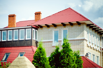 Large two-storey cottage made of white brick, Russia.