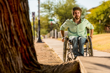 Man in Wheelchair Faces Sidewalk Obstacle
