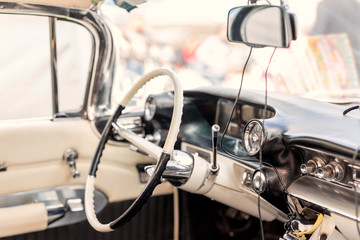 Retro car interior. Steering wheel and driver seat of vintage  vehicle. Classic  old automoile...