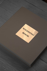 light wedding book on a white wooden background