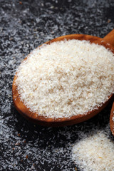 Portion of Psyllium Seeds on rustic dark background. Psyllium seed husks