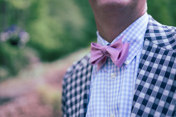 Man in pink bowtie and checked sport coat