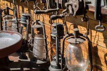 Old oil lamps used in households. Accessories for illuminating the interior of the home.