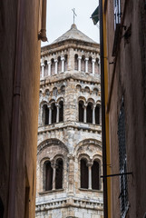 Glimpse of the bell tower of San Donato church in the downtown of Genoa