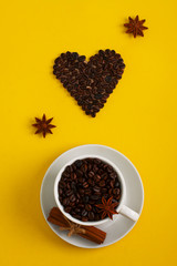 Cup of coffee seeds cinnamon anis coffee heart