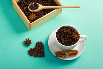 Wooden box spoon with coffee seeds cup of coffee hearts