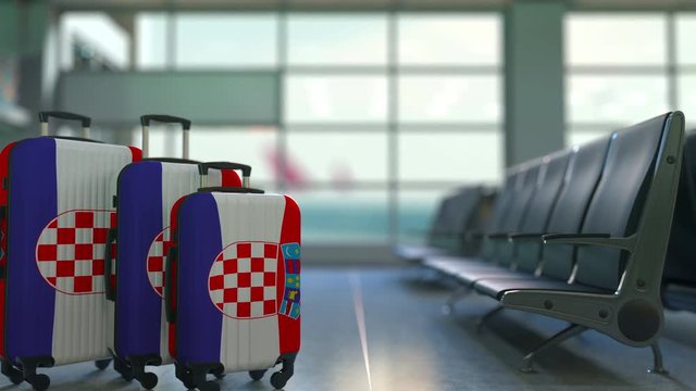 Travel suitcases featuring flag of Croatia. Croatian tourism conceptual animation