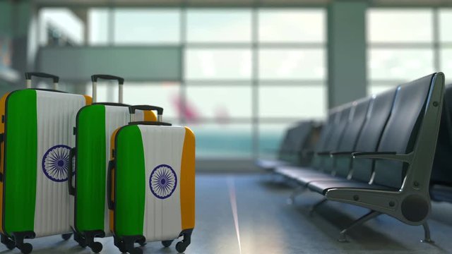 Travel suitcases featuring flag of India. Indian tourism conceptual animation
