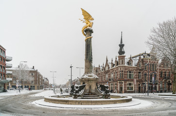 Den Bosch, The Netherlands, December 10th 2017: People passing the fountain on the Oranje...
