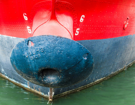 close up of the black mushroom anchor and draft marks on the red hull of historic LV116 Lightship Chesapeake in Baltimore's Inner Harbor