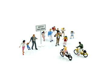 Fototapeta na wymiar Miniature people : student or children crossing road on way to school,Back to school concept.