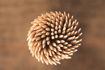 Many toothpicks in a round formation - obrazy, fototapety, plakaty