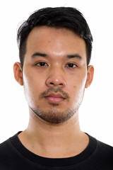 Obraz premium Studio shot of face of young Asian man 