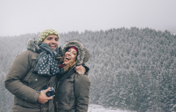 couple smiling in the snow