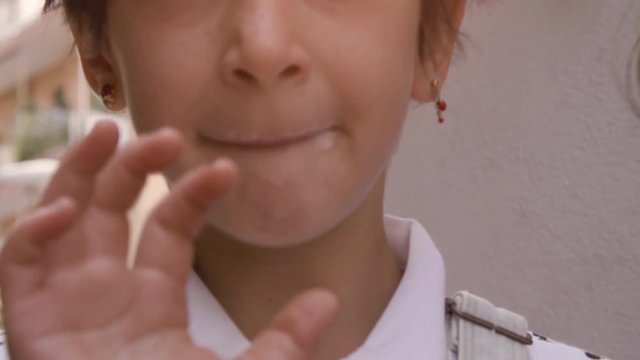 Happy cheerful young girls eating icecream cornetto dirty face kids