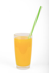 Orange juice in a glass with a tube isolated on white