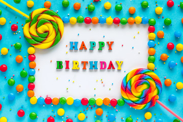 Text HAPPY BIRTHDAY, greeting card, candy and lollipops,