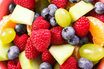 Fresh prepared fruit salad as background, healthy nutrition concept