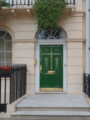 Fototapeta na wymiar green front door of London townhouse