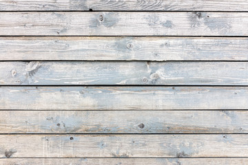 Obraz premium old shabby wooden planks painted with grey paint. weathered rustic background