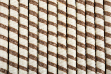 Striped wafer rolls filled with chocolate
