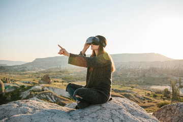 Woman with glasses of virtual reality. Future technology concept. Modern imaging technology.