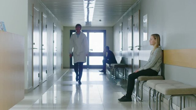 Following Shot of the Doctor Walking Through Hospital Hallway. Shot on RED EPIC-W 8K Helium Cinema Camera.
