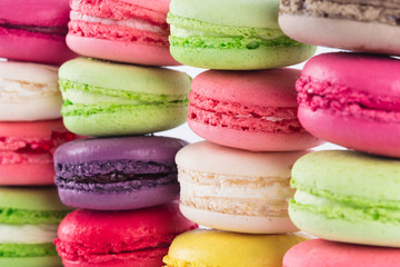background of colorful bright rows of biscuit meringue sweets