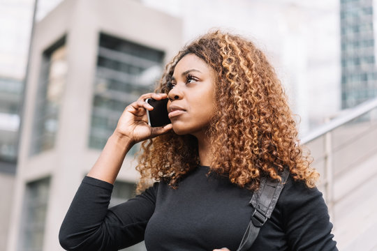 Attractive African woman taking a mobile call